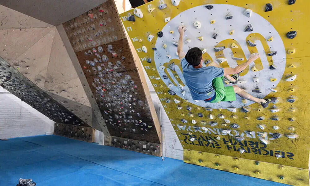 climber on moonboard training