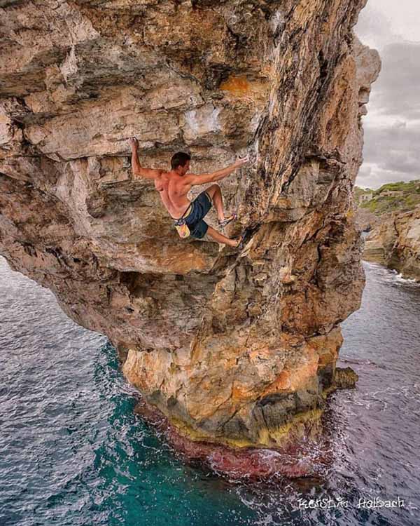 Jernej Kruder climbing Es Pontas in Mallorca, Deep water solo climb