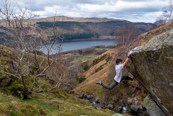 Aidan Roberts climber climbing V17 boulder in the peak district