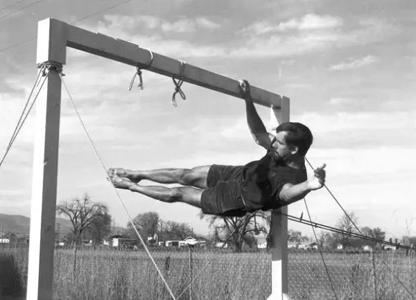 Climbr John Gill doing one arm side lever